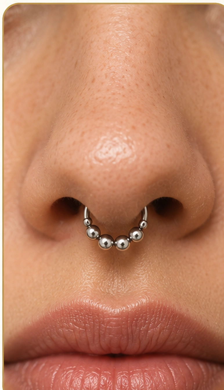 Referencia visual de piercing septum en la nariz